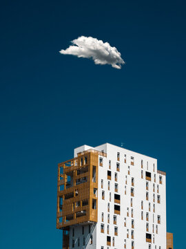Mordern buildin on a blue sky with one cloud over it