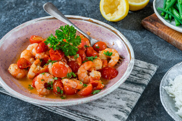 Jumbo king prawn with tomatoes and garlic garnished with fresh parsley