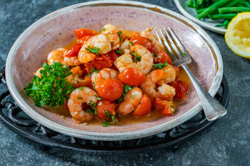 Jumbo king prawn with tomatoes and garlic garnished with fresh parsley