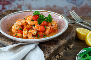 Jumbo king prawn with tomatoes and garlic garnished with fresh parsley