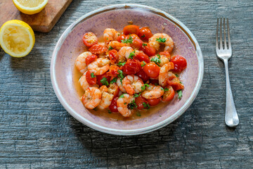 Jumbo king prawn with tomatoes and garlic garnished with fresh parsley