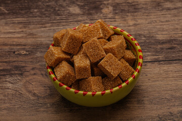 Cane sugar cubs in the bowl