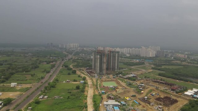 Aerial shot of a building under construction. 4k indian stock video of dwarka express way under construction.