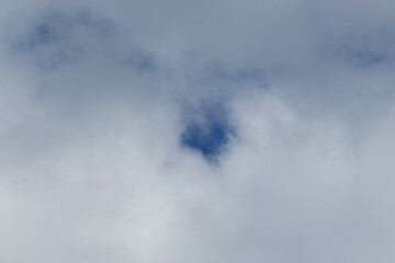 Blue sky background with white clouds around. autumn day