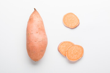 Sweet potato vegetable on a white background. Sliced ​​sweet potato. In the Cut.