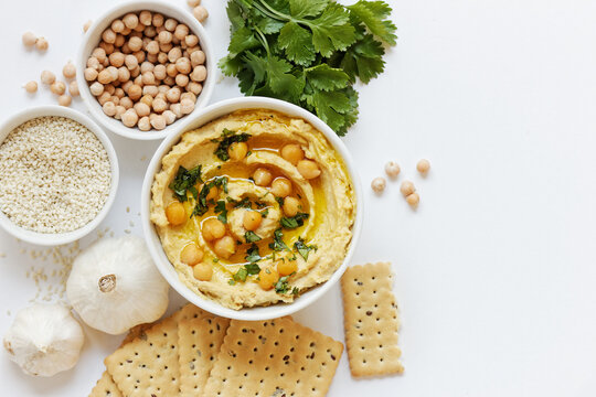 Hummus - Chickpea Traditional Jewish And Lebanese Cuisine Meal On White Background, Flat Lay, From Above Overhead Top View, Closeup, Houmous Is A Vegan Healthy Legume Food