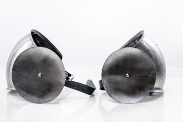 Steel metal knee pads to protect feet. Iron steel ammunition, personal accessories for a knight: helmet, chain mail, limb protection. concept is a reconstruction of battles. © vdeineka