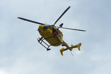 firefighters evacuating a casualty by helicopter during a training