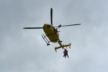 firefighters evacuating a casualty by helicopter during a training