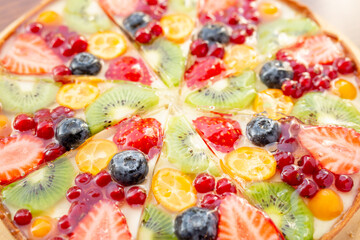Fototapeta na wymiar Fresh dietary dessert made of cow cream and frozen fruits and berries. Pie baked in oven. concept is vegetarian desserts.