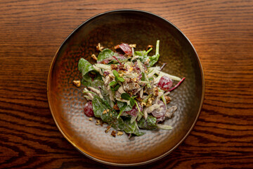 European Mediterranean salad of seasonal vegetables. Salad of tomatoes, cucumbers and fresh herbs with olive oil. Concept menu of summer cafe