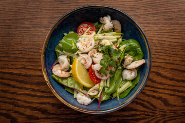 European Mediterranean salad of seasonal vegetables. Salad of tomatoes, cucumbers and fresh herbs with olive oil. Concept menu of summer cafe