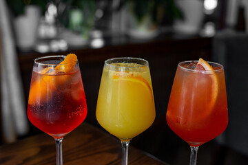 Aperitif is a refreshing cocktail of lemonade made from citrus slices. Soft drink with syrup and soda and ice cubes. Concept - summer thirst