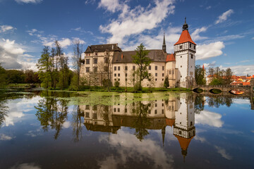 Blatna Castle in southern Bohemia reflected in the water