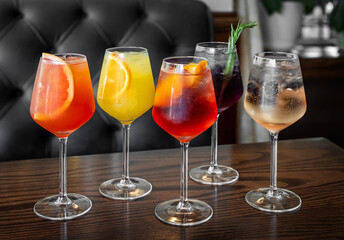 Aperitif is a refreshing cocktail of lemonade made from citrus slices. Soft drink with syrup and soda and ice cubes. Concept - summer thirst