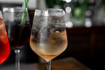 Aperitif is a refreshing cocktail of lemonade made from citrus slices. Soft drink with syrup and soda and ice cubes. Concept - summer thirst