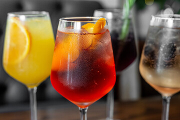 Aperitif is a refreshing cocktail of lemonade made from citrus slices. Soft drink with syrup and soda and ice cubes. Concept - summer thirst