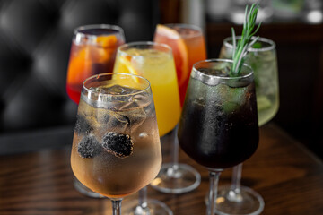 Aperitif is a refreshing cocktail of lemonade made from citrus slices. Soft drink with syrup and soda and ice cubes. Concept - summer thirst
