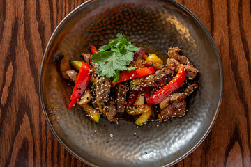 European Mediterranean salad of seasonal vegetables. Salad of tomatoes, cucumbers and fresh herbs with olive oil. Concept menu of summer cafe