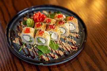 European rolls with rice and nori. composition of rolls: salmon, tuna, avocado, shrimp. Concept menu of summer cafe
