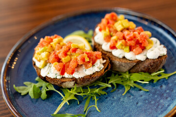 French bruschetta with cream cheese and thin sliced meat and baked vegetables.Concept menu of summer cafe
