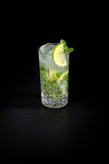 Aperitif is a refreshing cocktail of lemonade made from citrus slices. Soft drink with syrup and soda and ice cubes. Concept - summer thirst