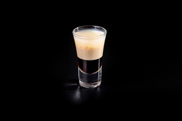 aperitif is an alcoholic cocktail made from various ingredients. Cocktail - one glass on a black background. concept is a holiday party.