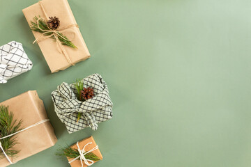 Zero waste new year concept. Christmas reusable sustainable gift wrapping alternative. Eco friendly christmas present in a furoshiki package. Copy space. High quality photo