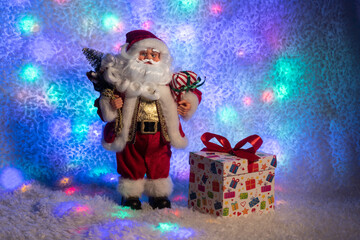 Toy Santa Claus with a bag of kinship gifts