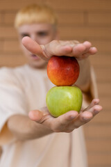 Fruits, healthy eating, organic food and people concept - Close-up of green and red apples standing...
