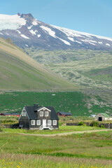 Fototapeta na wymiar Black wooden house in Arnarstapi, Snaefellsnes peninsula, Iceland
