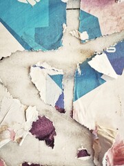 Old grunge ripped, torn vintage posters creased crumpled paper surface texture background