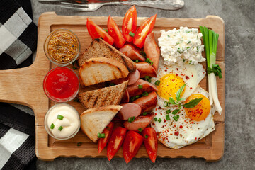 bruschetta with tomato, sausages and eggs