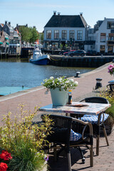 Fototapeta na wymiar Walking on old streets of Harlingen fisherman town on Wadden sea, Friesland, Netherlands