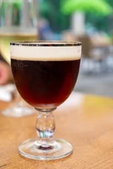 Fototapeten Glass of dark tasty Belgian dubbel brown beer from abbey brewery © barmalini
