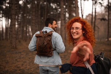 Couple in love and enjoying at public park in autumn