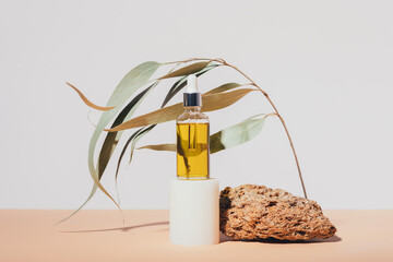 Natural organic cosmetic oil standing on podium