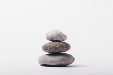 Stack of stones on white background