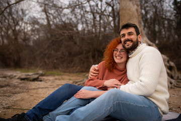 Young couple enjoying the autumn day at park