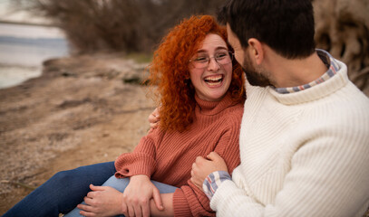 Young couple enjoying the autumn day at park