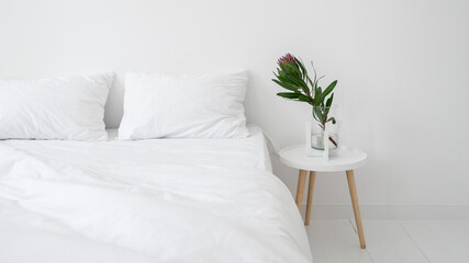 White minimalist bedroom with modern interior design