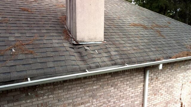 Roof and shingles damaged from water leak and leaves