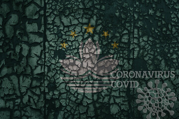 flag of Macau on a old metal rusty cracked wall with text coronavirus, covid, and virus picture.