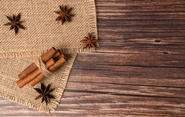 Cinnamon sticks and star anise on sacking. Seasoning in cooking.