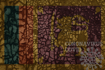 flag of sri lanka on a old metal rusty cracked wall with text coronavirus, covid, and virus picture.