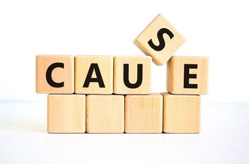 Cause symbol. The concept word 'cause' on wooden cubes on a beautiful white table, white background. Business and cause concept. Copy space.