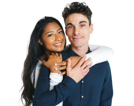 Young Couple Standing Together Posing In Studio White Background