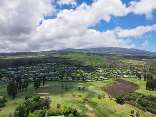 Aerial view of mountain landscape and small village in the west coast of Maui. Hawaii, USA