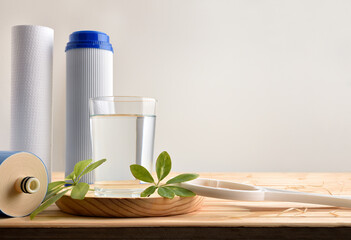 Purified water with environmentally friendly filters on wood table front