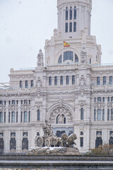 The Cibeles fountain in Madrid on a snowy day
